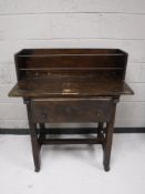 A stained pine side table fitted a drawer