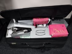 A suitcase containing new boxed ladies and children's shoes