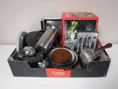 A box of wine glasses, cutlery, cast iron pans,