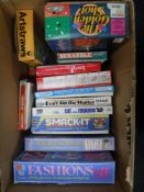 A box containing vintage board games and toys, including Shot Fashion wheel,