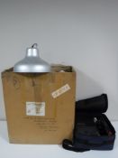 A box containing a photographic enlarger,