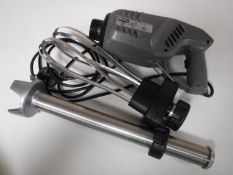 A Buffalo commercial mixer with accessories