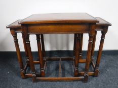 A nest of three contemporary mahogany tables
