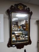 A mahogany framed Chippendale style wall mirror CONDITION REPORT: 88cm by 48cm.