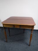 A Victorian mahogany turnover top tea table