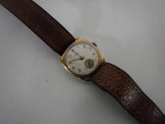 A 9ct gold Avia wristwatch on leather strap