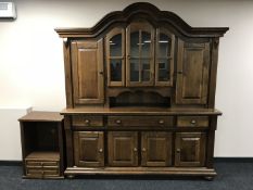 A heavy oak shape topped four drawer dresser in a continental style on bun feet,