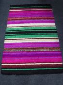 A contemporary machine made striped rug with silk pile