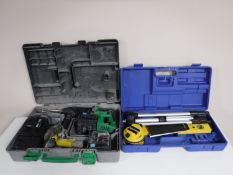 A cased Hitachi cordless rotary hammer drill,