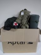 A box containing army surplus equipment, including British army and RAF shirts, rolled matt,