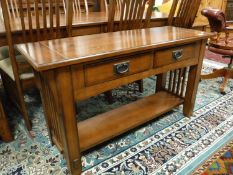A contemporary arts and crafts style oak two tier low sideboard,