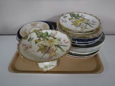 A tray containing a quantity of assorted wall plates and tea plates,