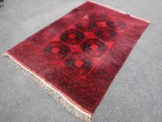 A fringed Bokhara rug