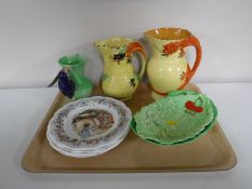 A tray of Burleigh ware vases, two Carlton Ware leaf dishes, woodpecker handled pottery vase,