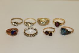 A collection of 8 gold rings, 23.