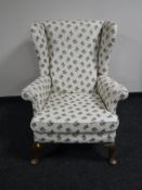 A wing back armchair