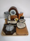A tray containing an early twentieth century mahogany mantel clock, oak barometer,