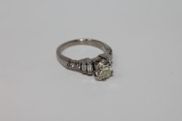 An 18ct gold solitaire diamond ring, the principal stone weighing an estimated 1.