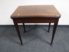 A late Victorian mahogany turnover top tea table