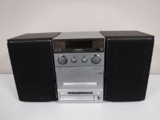 A Panasonic stereo CD system with speakers