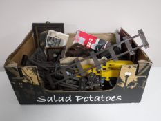 A box of tin plate track, horn walking stick handle, cameras, trivet,