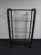 A set of contemporary metal three tier shelves