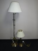 A contemporary floor lamp with shade and matching table lamp