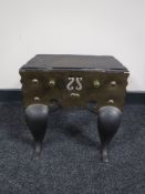 A 19th century cast iron and brass footman