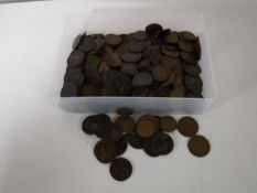 A tub containing a quantity of Victorian and Georgian pennies and half pennies