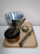 A tray containing an Amigos beer ice bucket, two brass gauges,