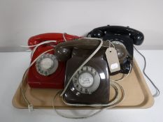 Two vintage Bakelite telephones and a retro style phone