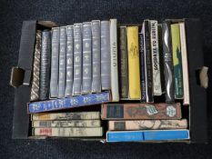 A box of Folio Society books in slip covers