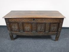 An 18th century and later panelled oak coffer