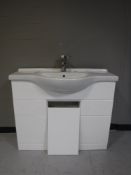 A ceramic hand basin with tap,