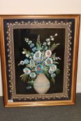 A Victorian stumpwork picture depicting flowers in a vase
