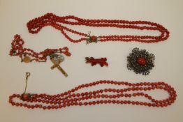 Three coral necklaces and two brooches CONDITION REPORT: Single strand necklace 95cm