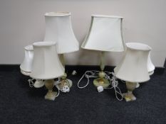 Three pairs of onyx table lamps with shades