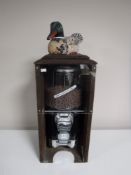 A duck feed dispenser in case,