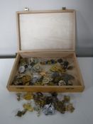 A box containing a quantity of military badges