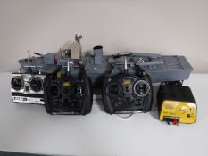 A remote controlled naval gun boat, together with a Pro Peak charger,
