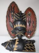 Two carved tribal wall masks,