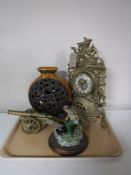 A tray containing a brass French style mantel clock, together with a brass cannon,
