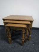 A nest of three oak tables,