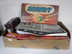 Three boxes containing mid twentieth century and later board games and toys