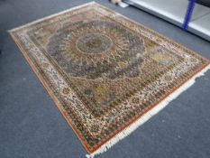 A machine made carpet of Tabriz design,