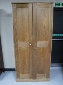 A pitch pine double door cupboard,