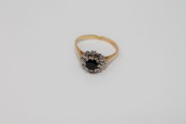 An 18ct gold diamond and sapphire cluster ring CONDITION REPORT: Size O.