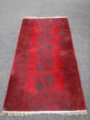 A fringed Bokhara rug