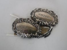 Two sterling silver decanter labels,