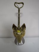 A brass fox's head door stop